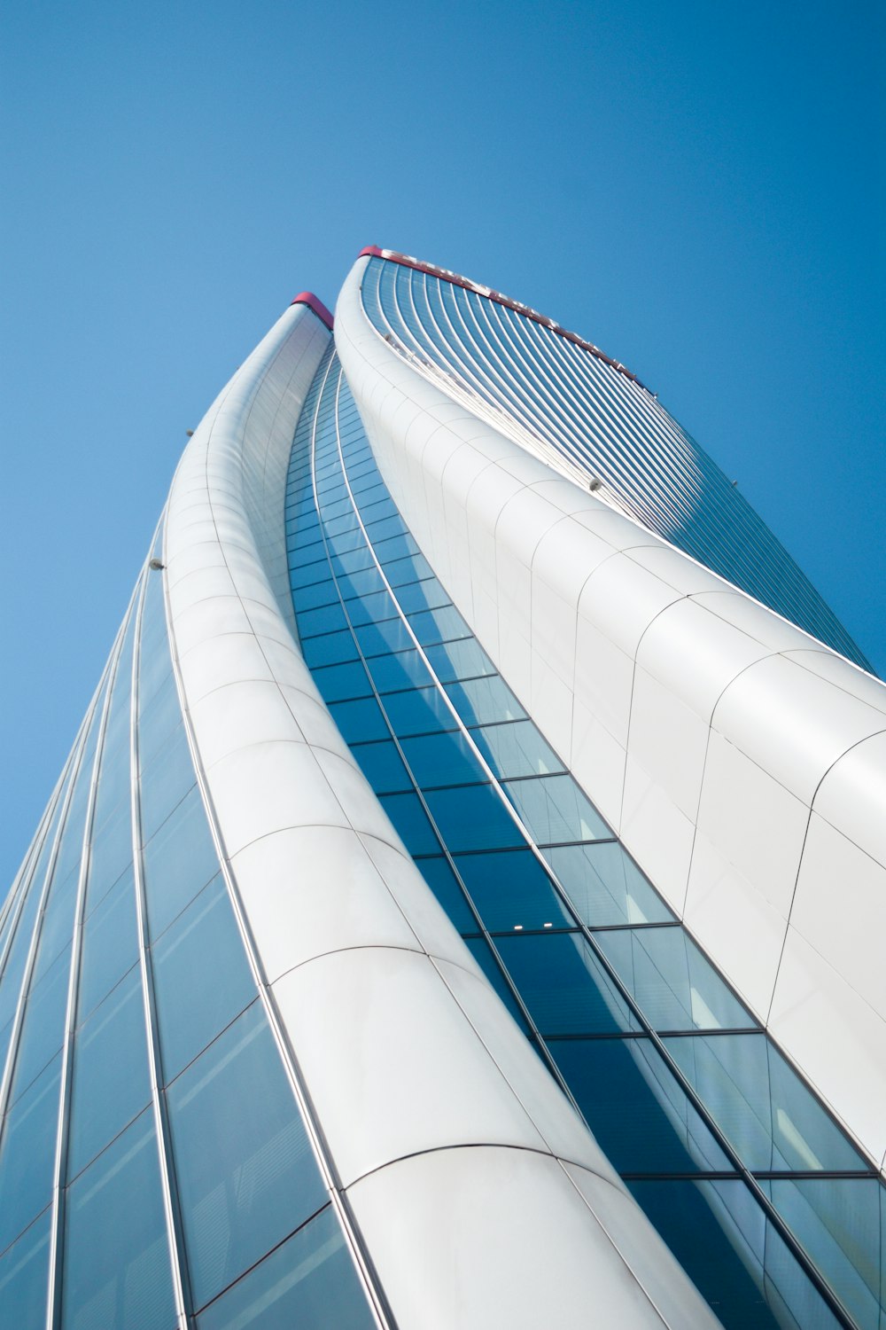 white and blue glass walled building