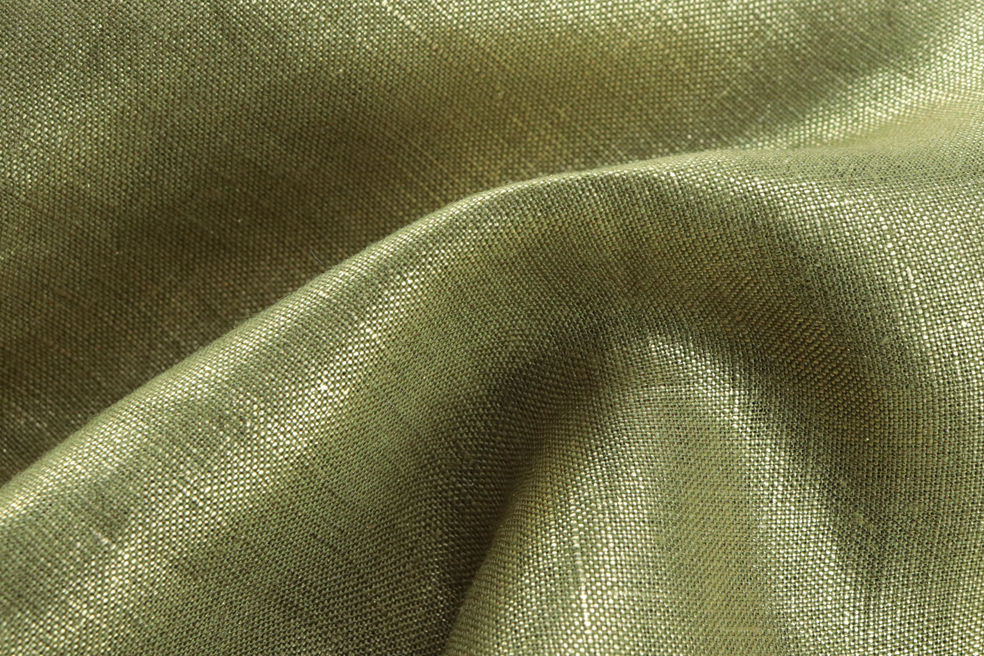 Close-up of premium silk blend fabric draped gracefully, highlighting its smooth texture and subtle sheen under warm lighting.