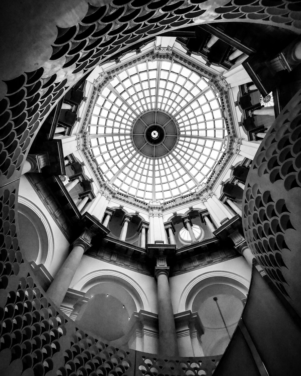 low angle photography of white and black dome ceiling