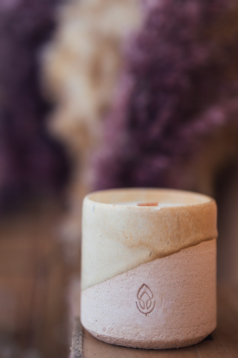 brown pillar candle with heart shaped drawing