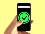 black android smartphone displaying green and black logo