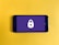 A smartphone placed on a bright yellow background displays a lock symbol on its screen, which is colored in a flat purple shade. The lock symbol suggests themes of security or privacy.