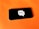 A smartphone rests on a bright orange surface. The screen displays a graphic of a white speech bubble with a wireless signal icon inside.