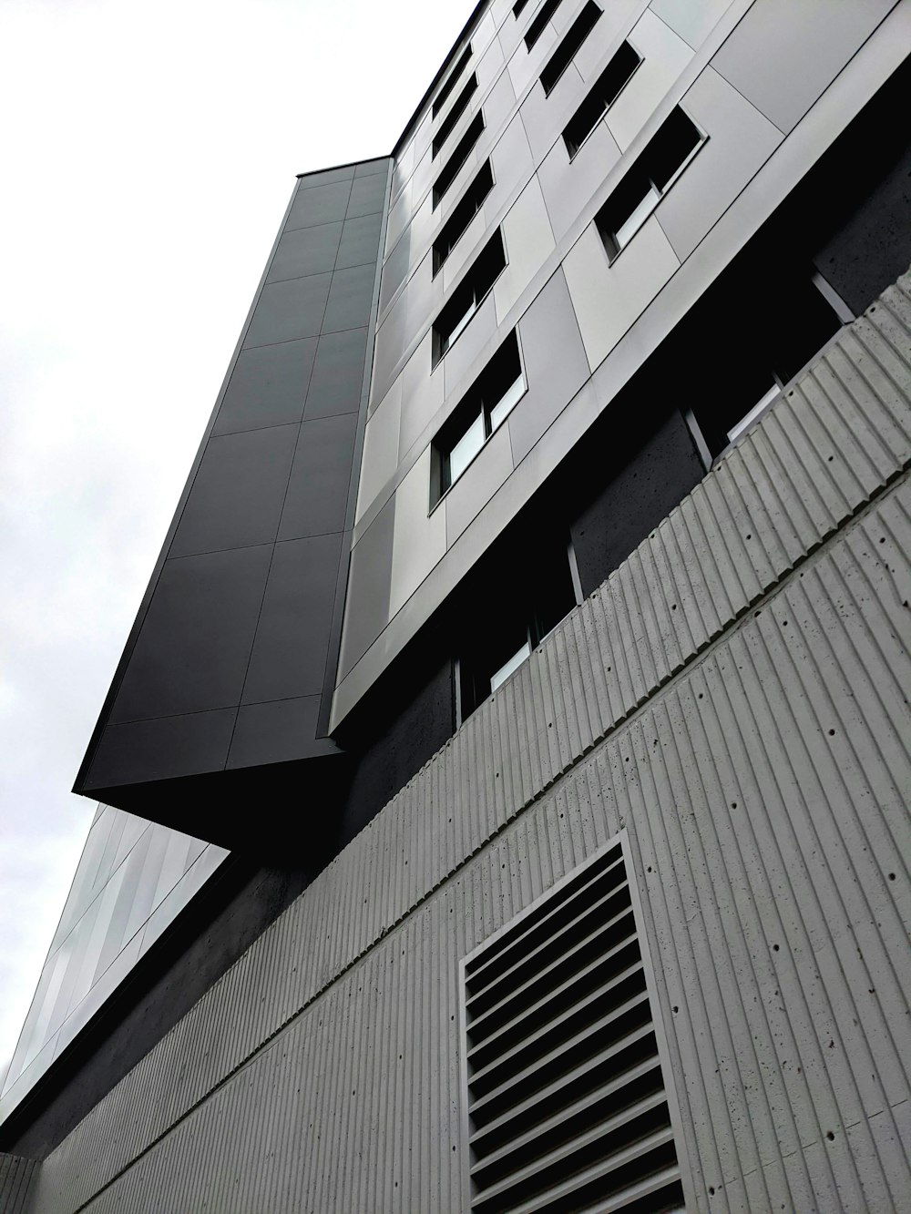 gray concrete building under white sky during daytime