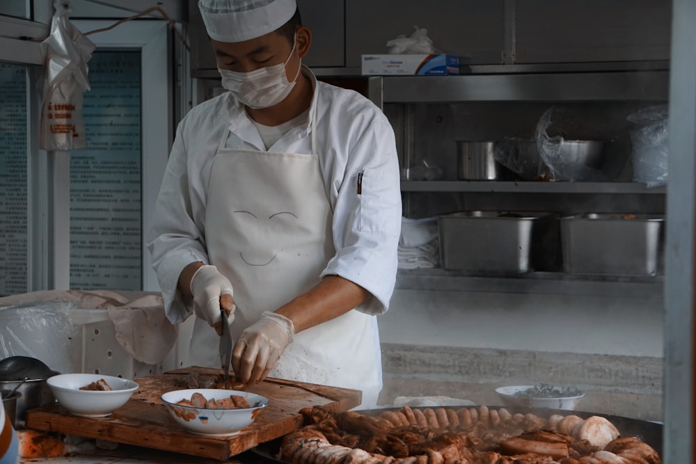 chef holding knife slicing meat