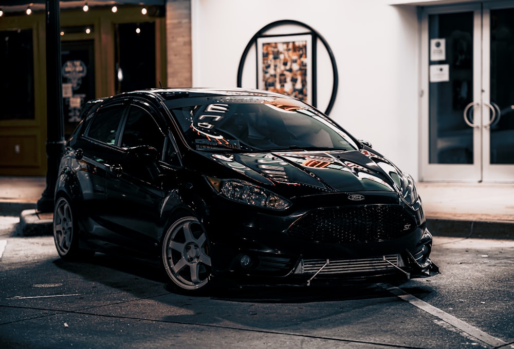 black honda car parked on the side of the road