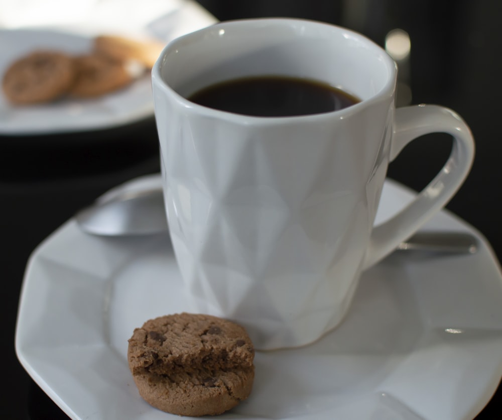 white ceramic mug with black coffee