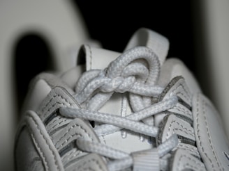 A close-up of colorful shoelaces and sneaker details.