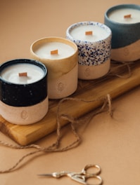 Handmade DIY candle, DIY art & crafts, home decor, black and white candle on brown wooden holder.