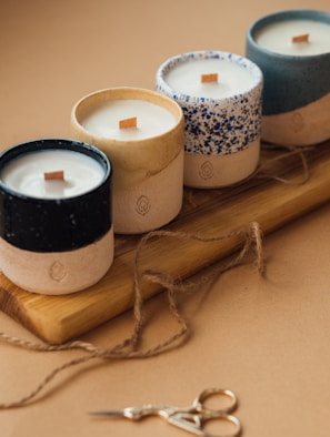 black and white candle on brown wooden holder