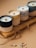 black and white candle on brown wooden holder