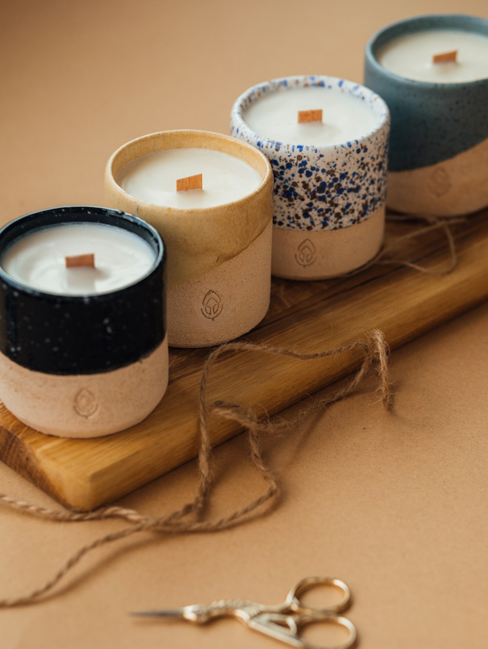 black and white candle on brown wooden holder