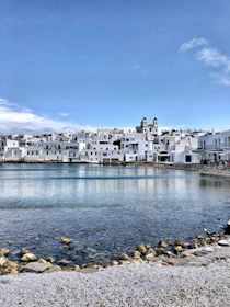 white concrete building near body of water during daytime