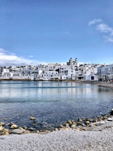 white concrete building near body of water during daytime
