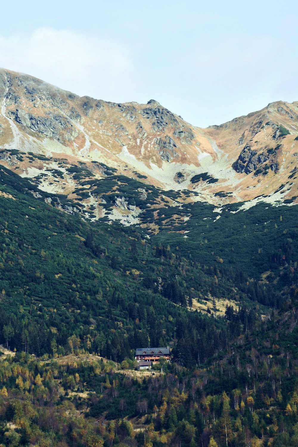 red and white house on top of the mountain