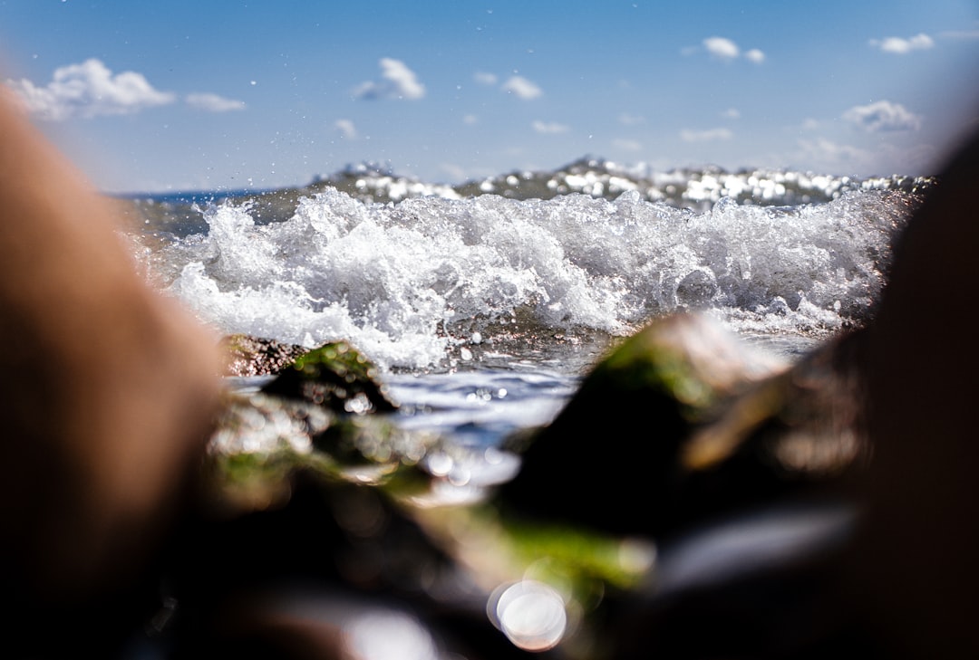 water waves on the shore during daytime