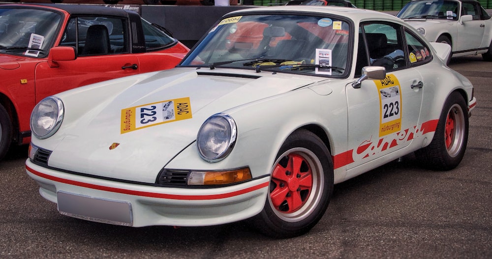 white and orange porsche 911