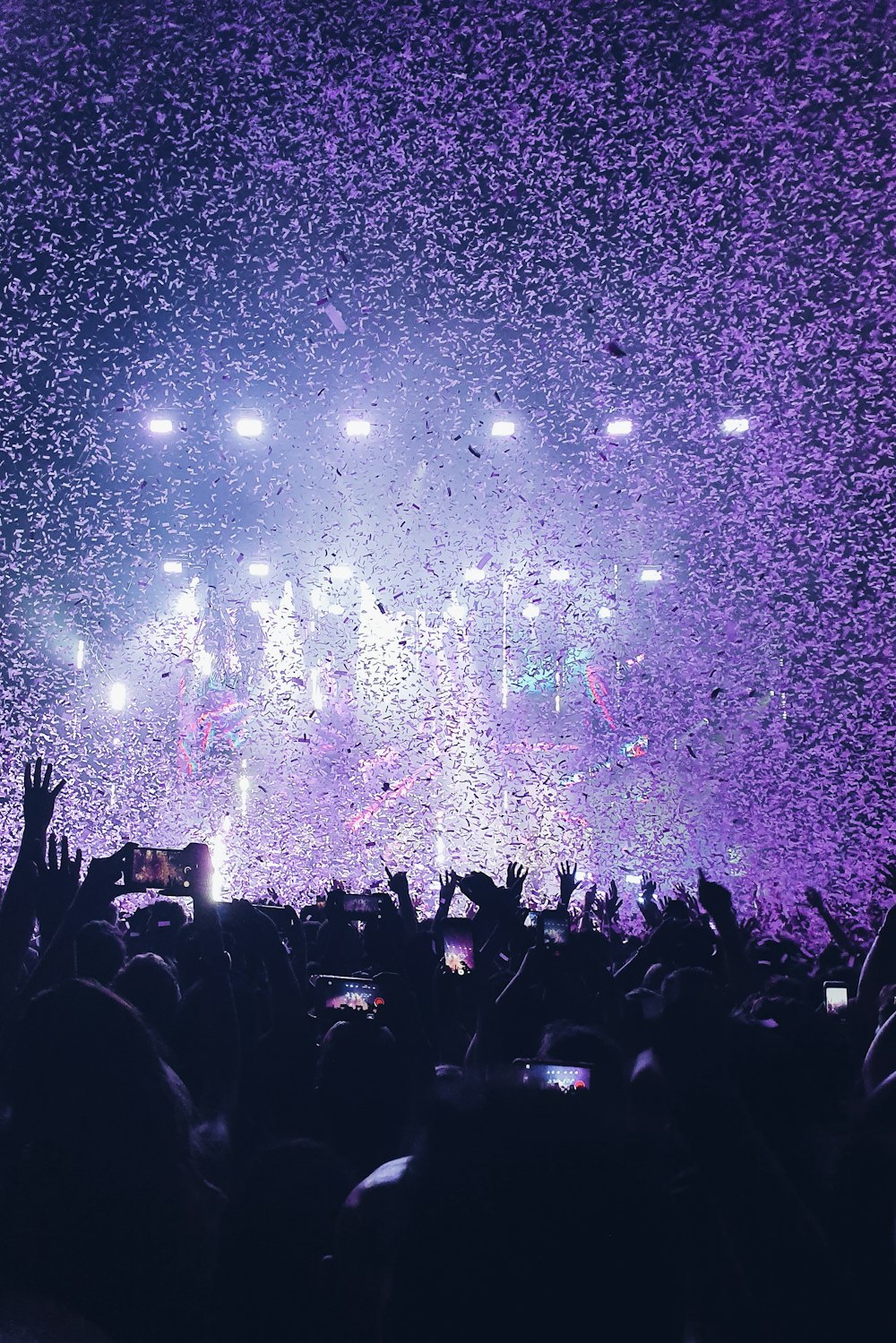 group of people standing on the field with bubbles