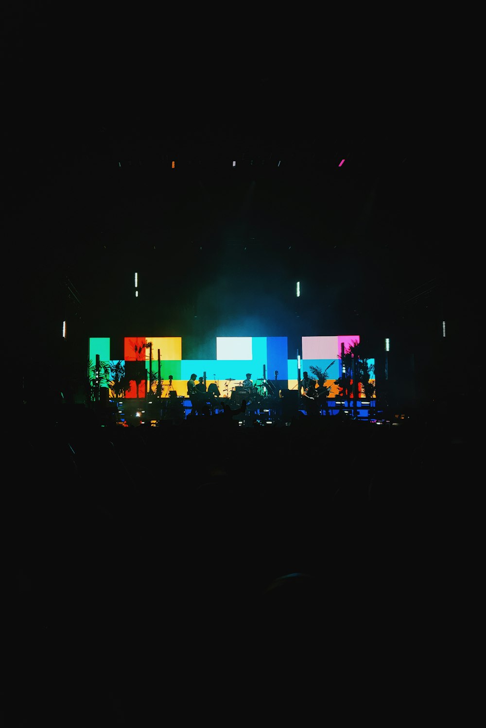 people standing on stage during nighttime