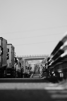 An image depicting a fleet of trucks on the road.