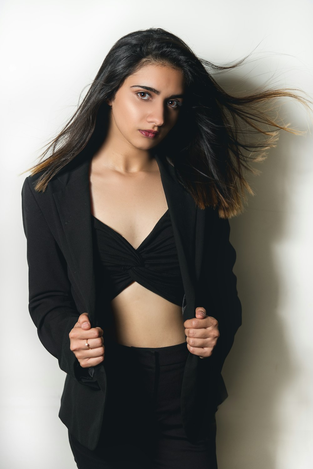 woman in black blazer and black brassiere