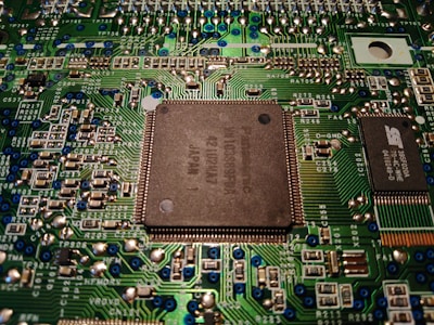 Close-up of a computer motherboard with visible circuits and components.