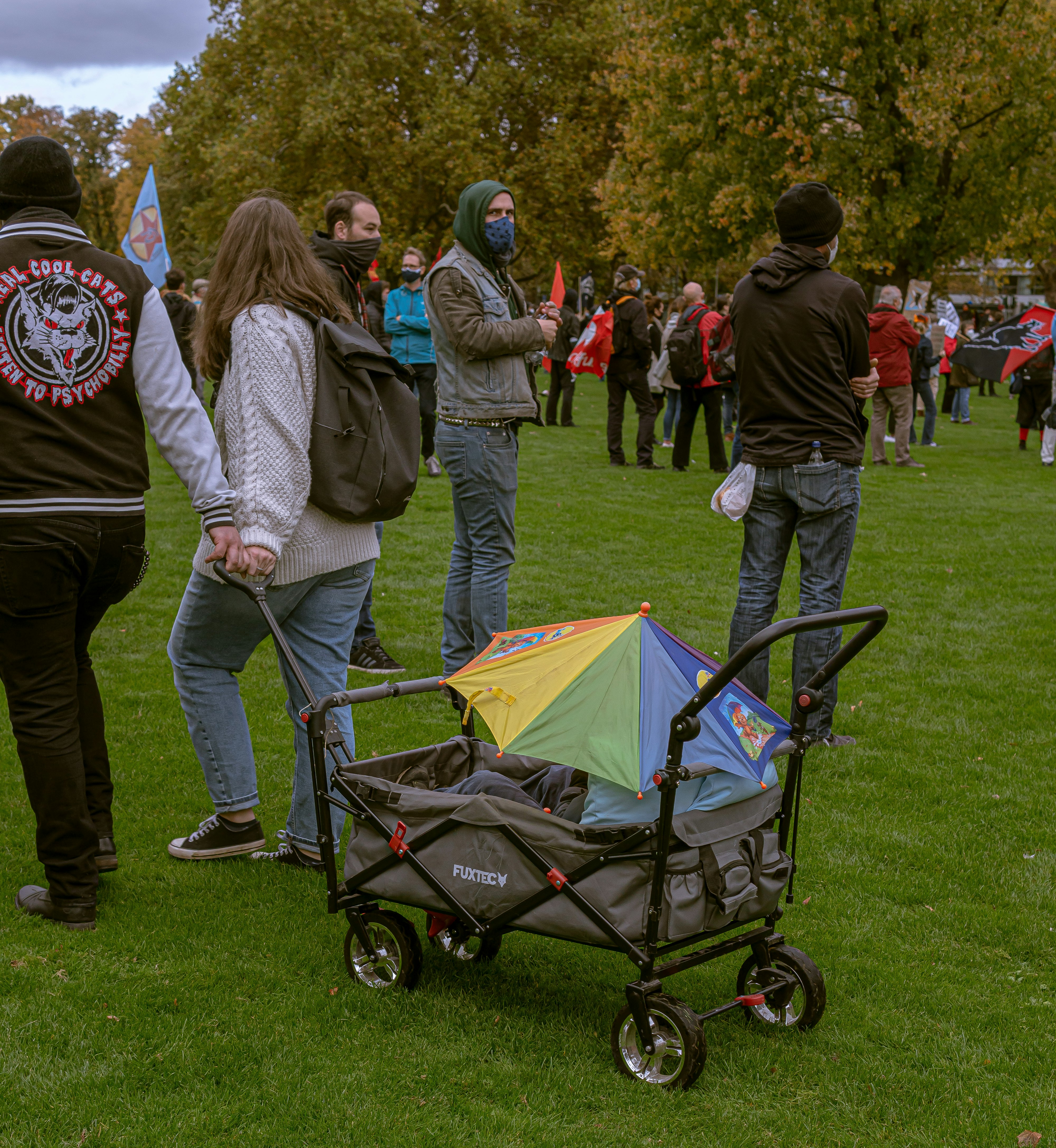 people standing on green grass field during daytime