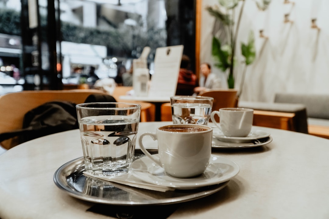 white ceramic teacup on saucer