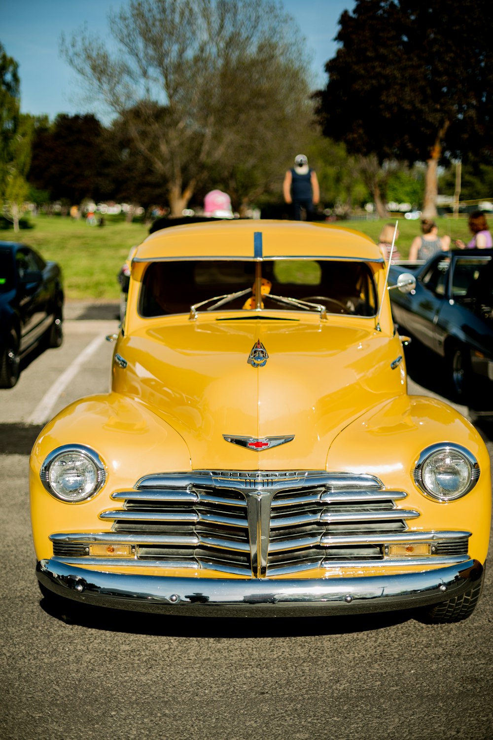 yellow chevrolet car on road during daytime