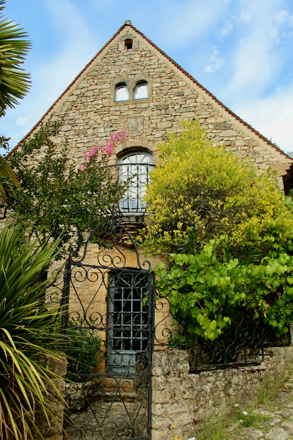 brown brick building with black metal window