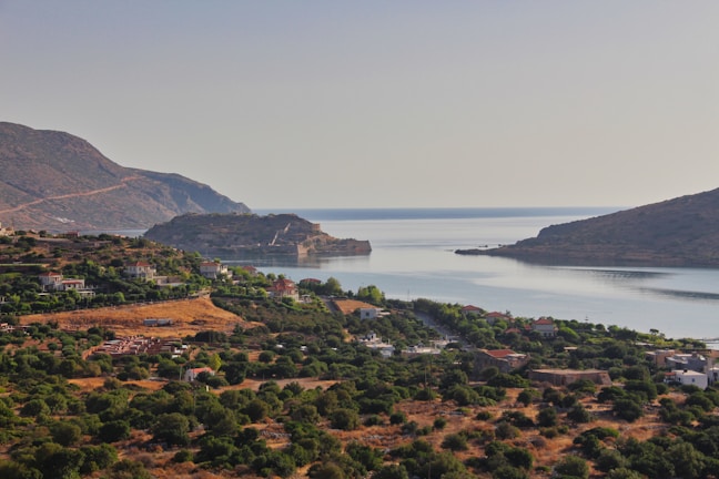 A peaceful coastal view  of Salling peninsula with calm Limfjord waters and green hills.