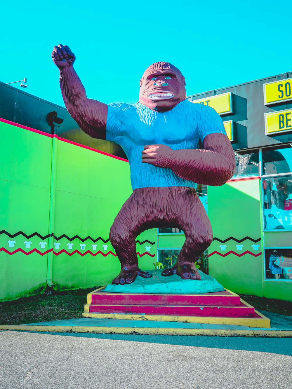 man in blue and black shorts statue