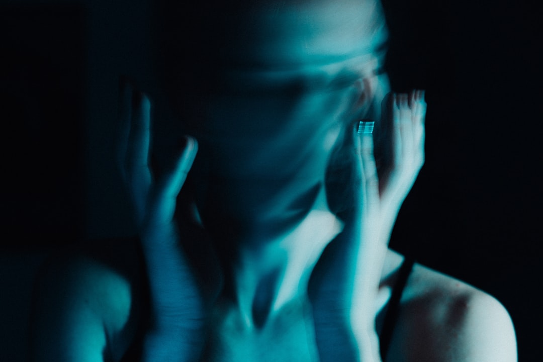 woman in blue dress with blue manicure