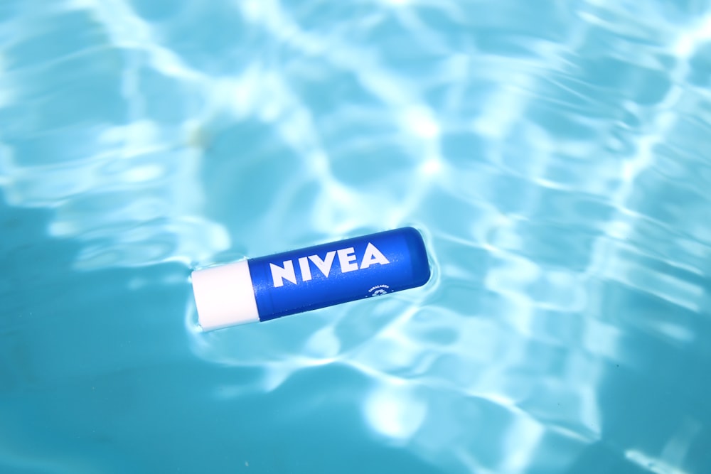 blue and white nivea plastic bottle