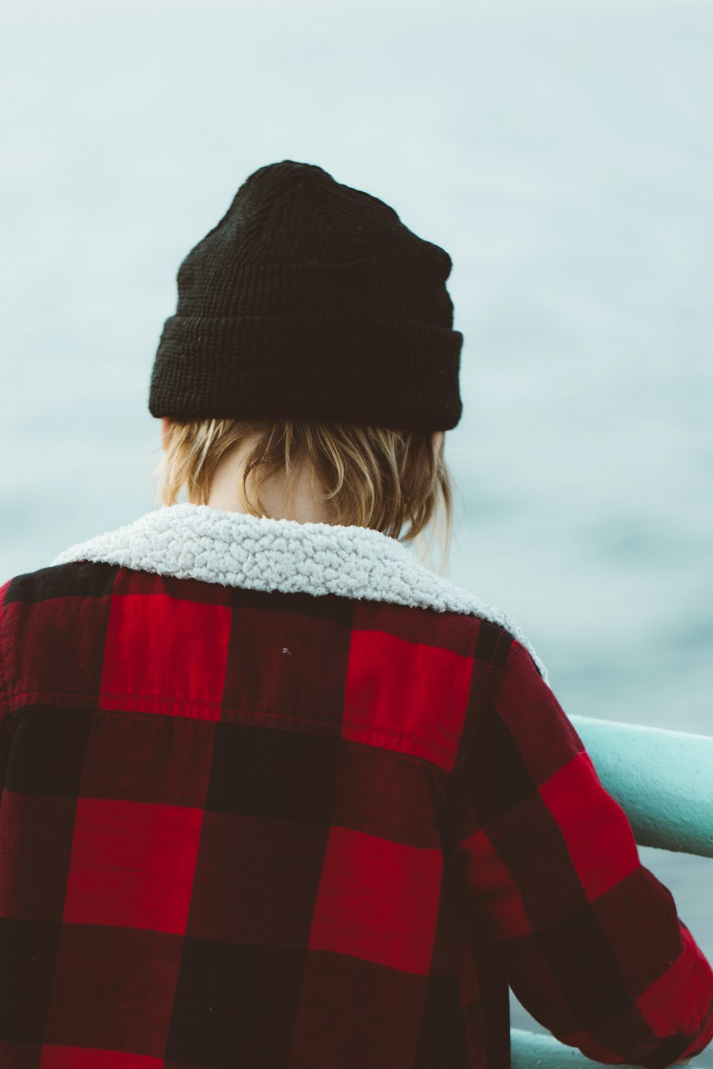 woman in red and black knit sweater