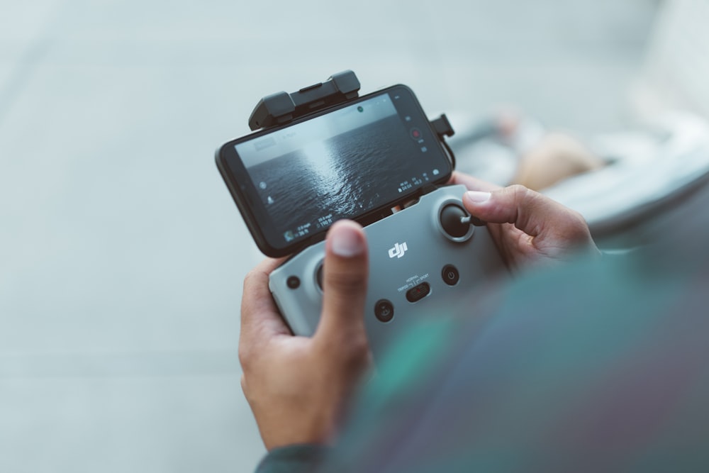 person holding red and black nintendo switch