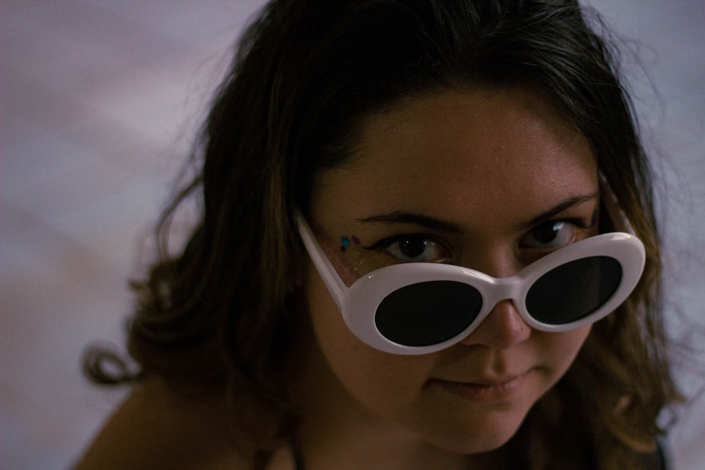 woman wearing white framed sunglasses