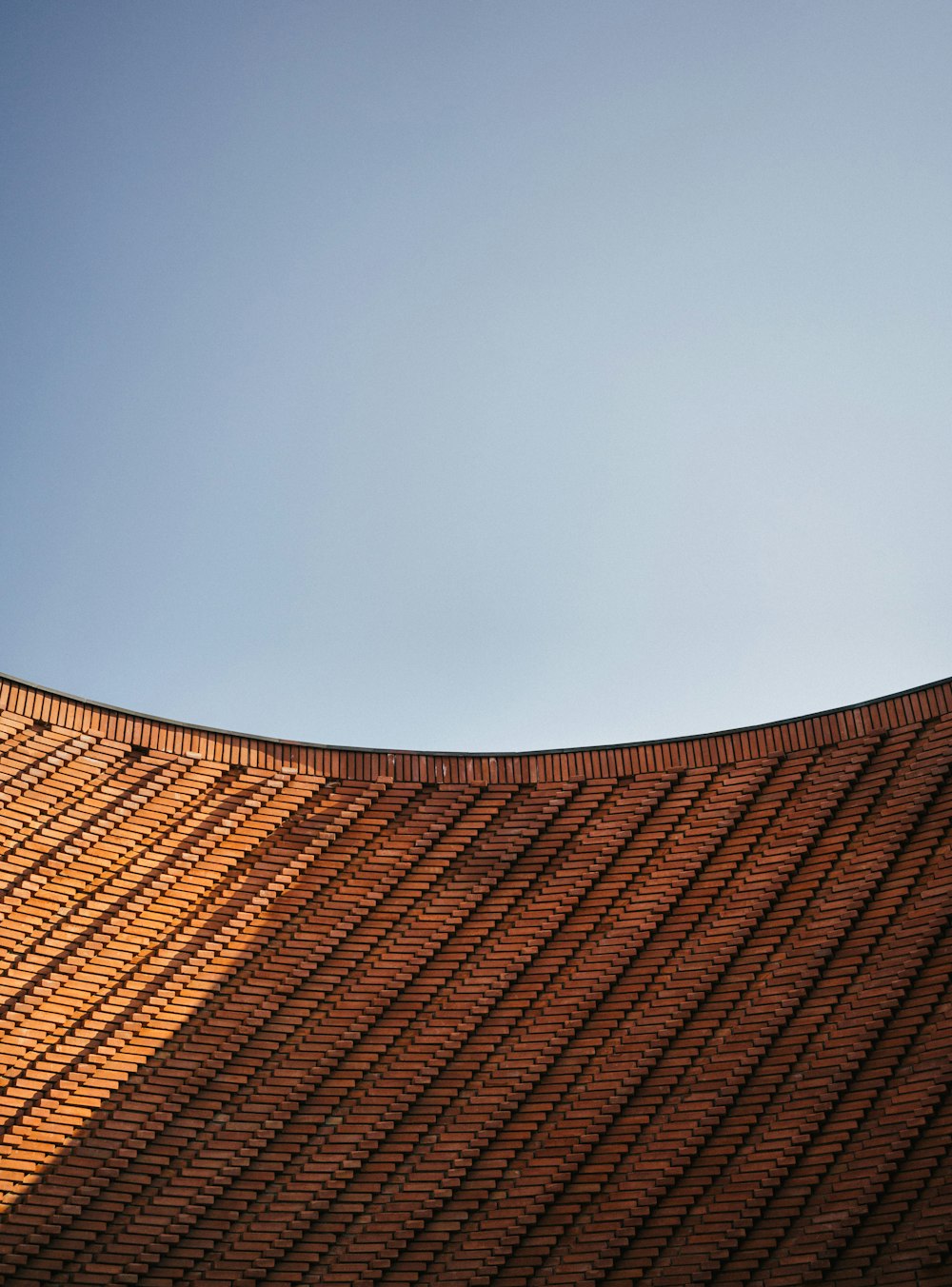 brown and beige roof under blue sky