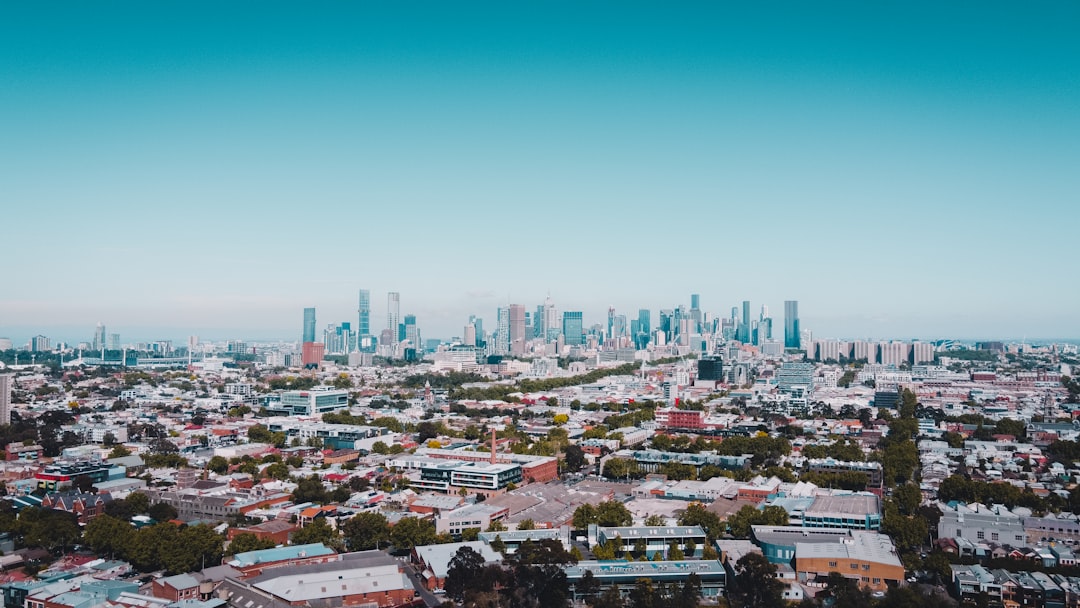 city with high rise buildings under blue sky during daytime