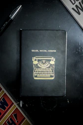 A creative copywriter jotting down catchy headlines on a notepad.