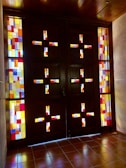 A custom-made door with stained glass panels glowing in the afternoon light.