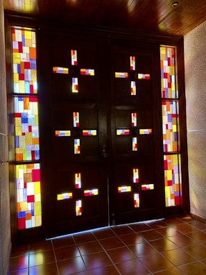 A custom-made door with stained glass panels glowing in the afternoon light.