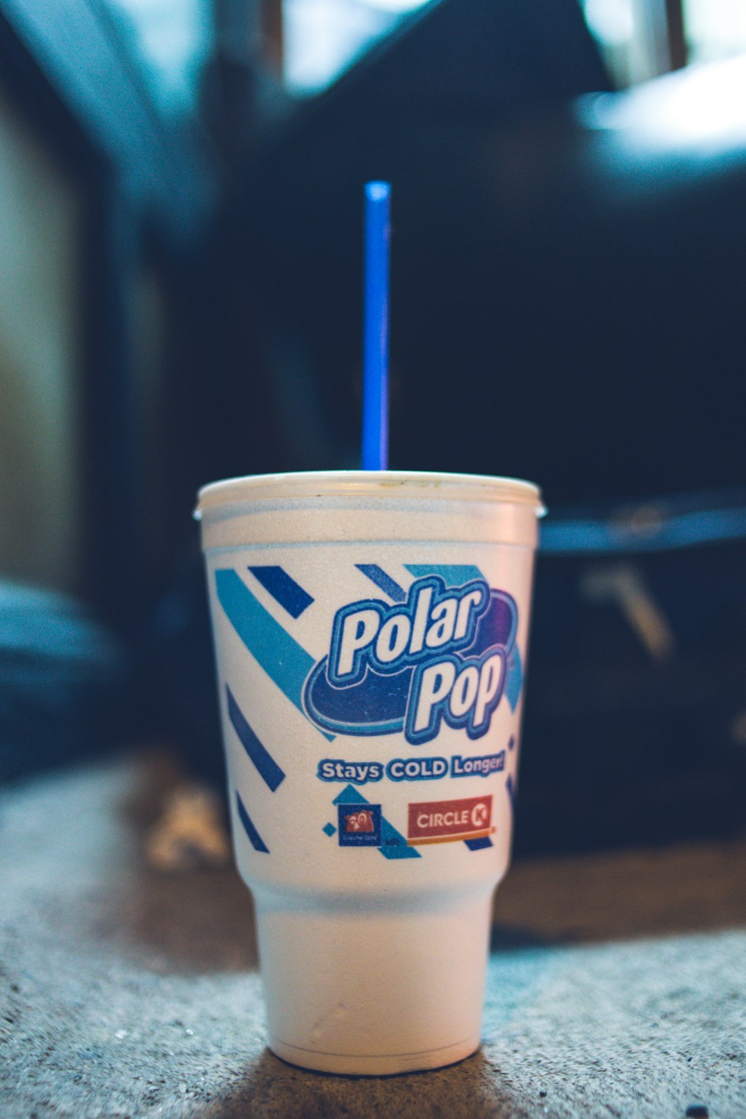 white and blue plastic cup