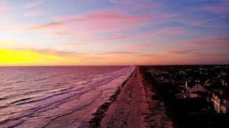 A vibrant sunset over the pristine coastline near Sancang.