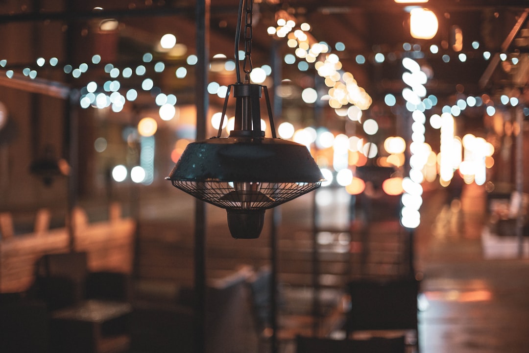 black pendant lamp turned on during night time