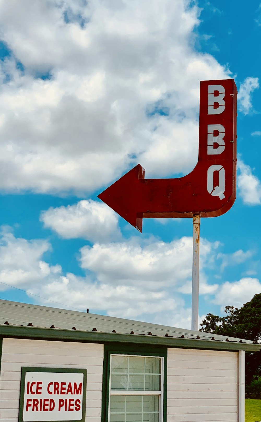 red and white arrow sign