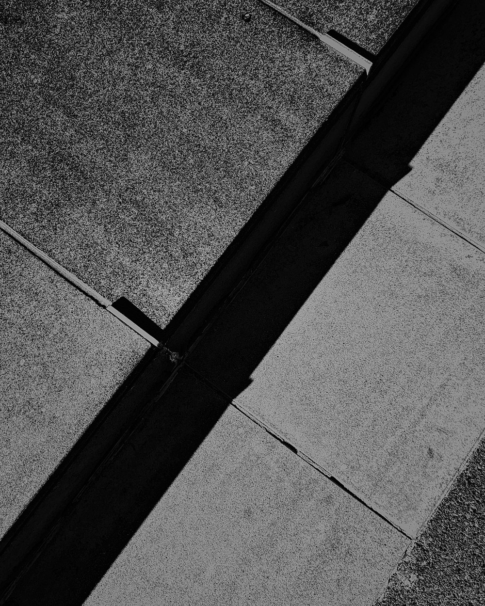 black metal rod on gray concrete pavement