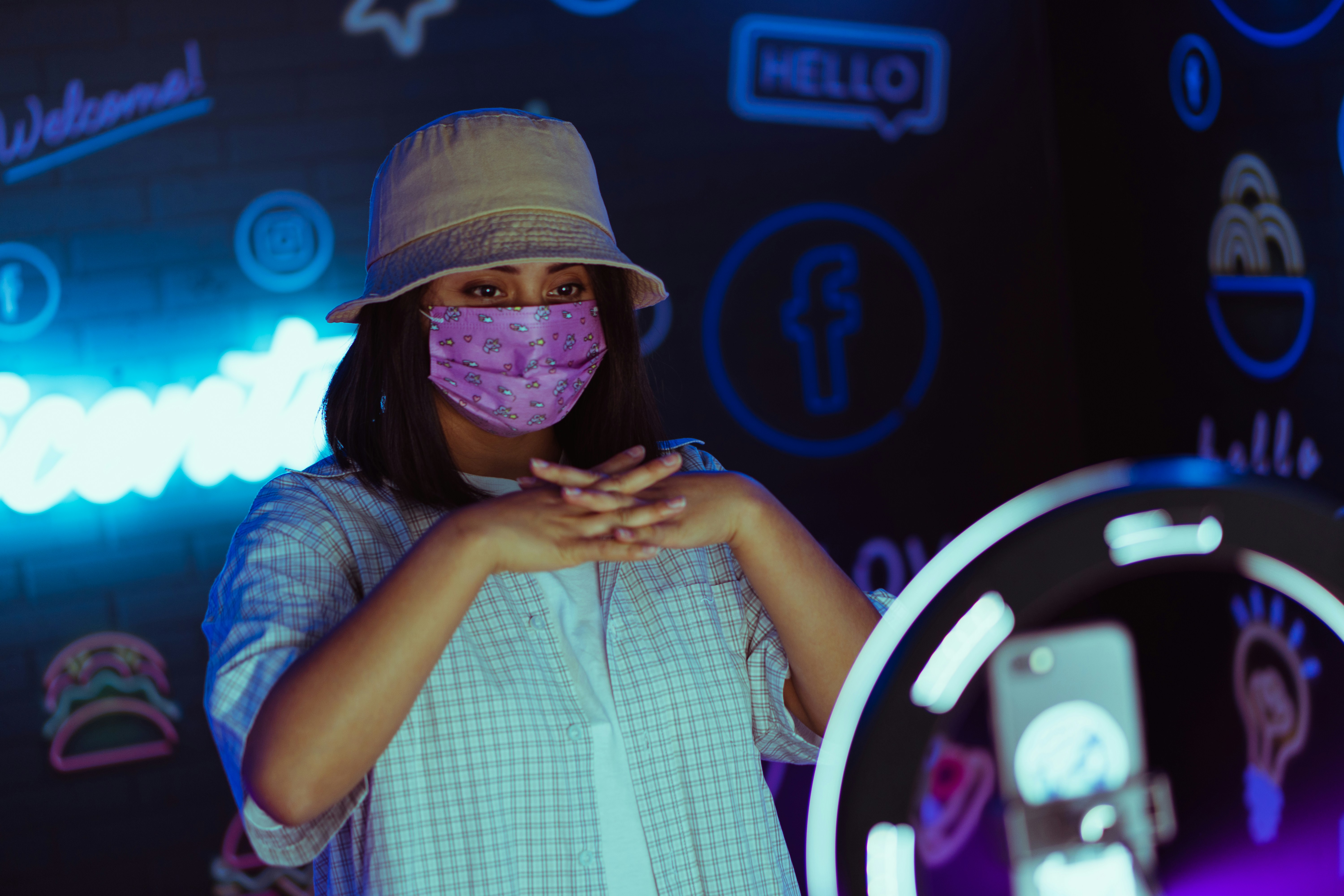 woman in white and blue checked button up shirt wearing white hat