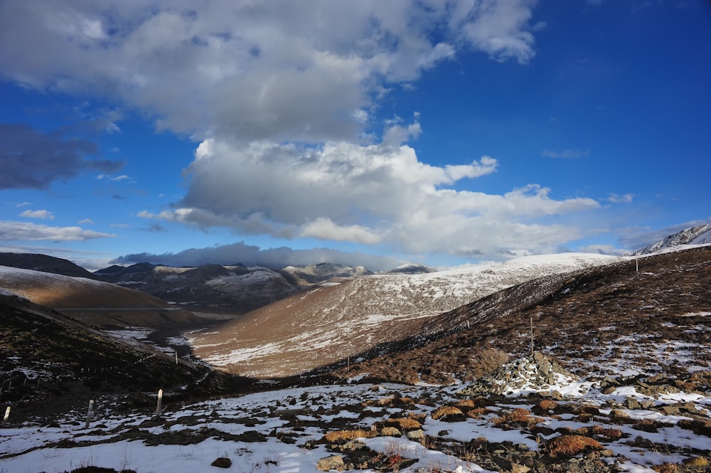 brown and white mountains under blue sky during daytime