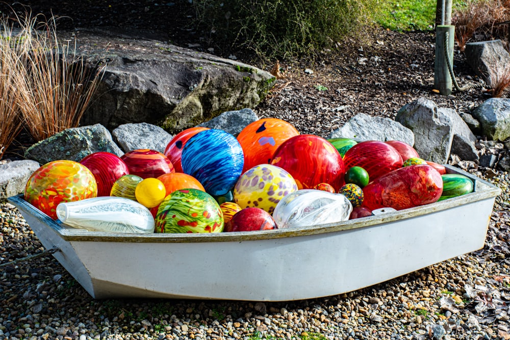 red and white round fruits on white boat